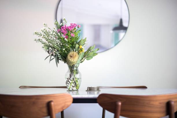 istock Decorative vase with a floral bouquet on an empty dining table 1432507150