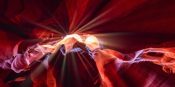 Sunbeams inside red sandstone caves in Antelope Canyon