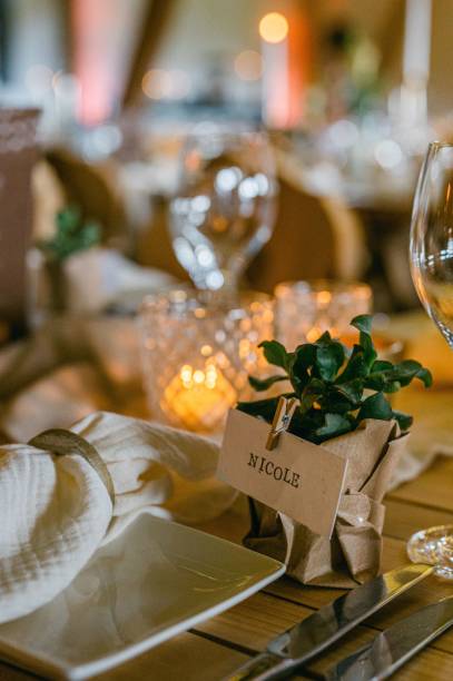 istock Vertical shot of a table arrangement with a name clipped on a small artificial flower pot 1432509237