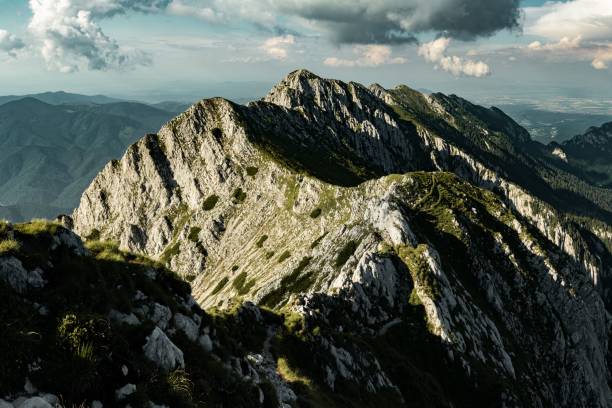 istock Scenic shot of rocky mountain covered with sun rays 1432509666