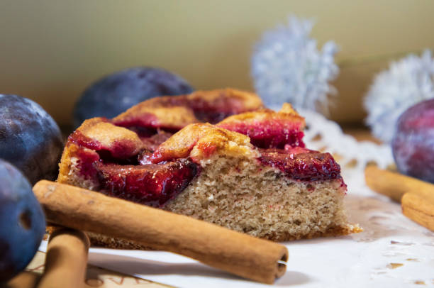 New York Times recipe plum cake and cinnamon sticks stock photo