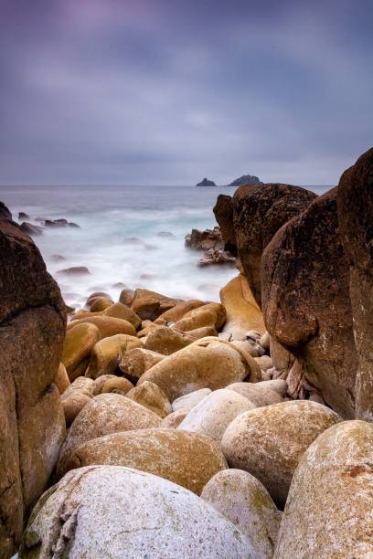 istock Vertical shot of pebbles on the coast on a cloudy day 1432511539