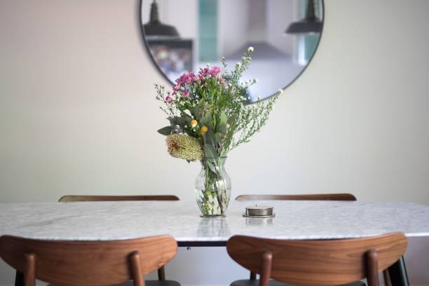 istock Decorative vase with a floral bouquet on an empty dining table 1432513378