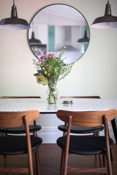 istock Vertical shot of a decorative vase with a floral bouquet on an empty dining table 1432513381