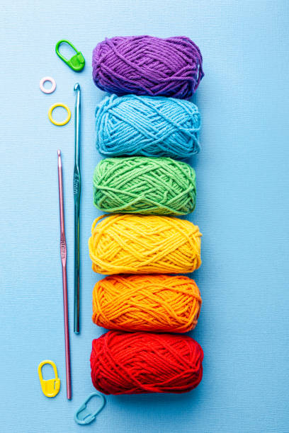 istock Crochet composition with cotton rainbow yarn, crochet hooks and accessories. Flat lay overhead shot 1432514434