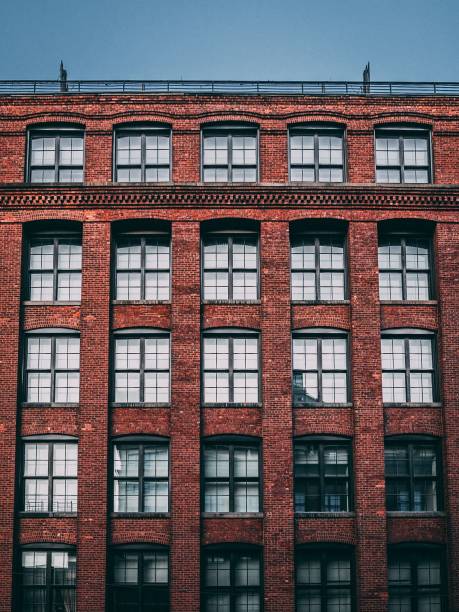 istock Closeup of a brick building against a blue sky 1432514742