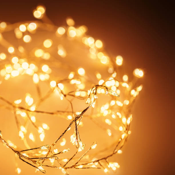 istock Christmas golden lights Background. Abstract twinkled bright bokeh defocused lights 1432516247