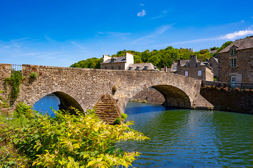 Le Port de Dinan Le Vieux Pont bridge over La Rance river in french Bretagne Brittany picturesque town in France. Walled Breton town in the Côtes-d'Armor
