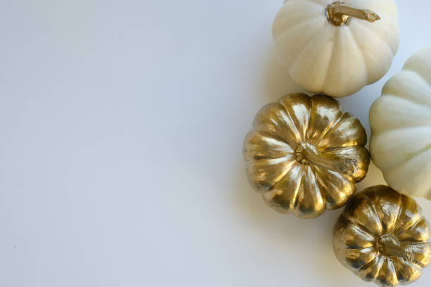 istock Modern composition in autumn style with white and golden pumpkins on a light background. Halloween, Thanksgiving party concept. Background for blog place for text. Empty space for text 1432517257