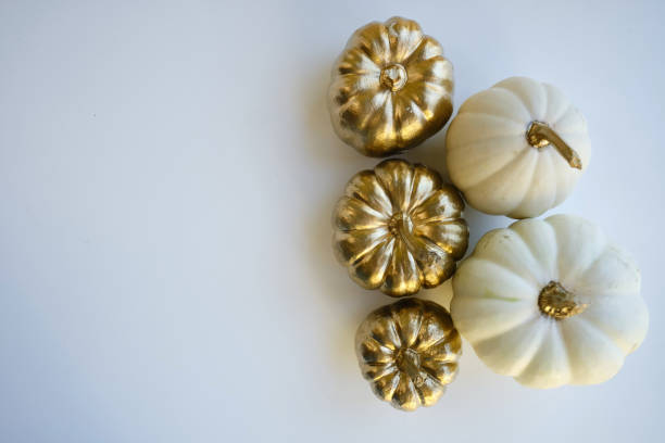 istock Modern composition in autumn style with white and golden pumpkins on a light background. Halloween, Thanksgiving party concept. Background for blog place for text. Empty space for text 1432517262