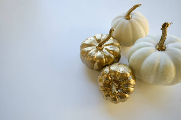istock Modern composition in autumn style with white and golden pumpkins on a light background. Halloween, Thanksgiving party concept. Background for blog place for text. Empty space for text 1432517268
