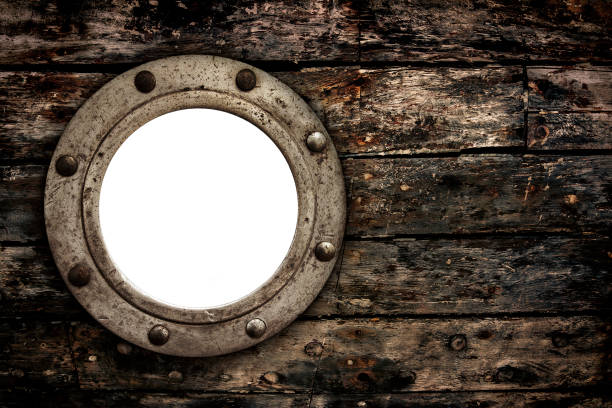 istock Empty Old Porthole Window on Wooden Boat Hull 1432519668