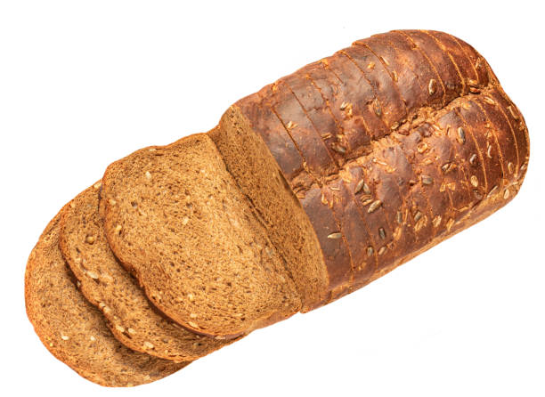 istock Bread loaf with  slices and seeds   viewed from above isolated on white background. Top view. Flat lay. 1432519681