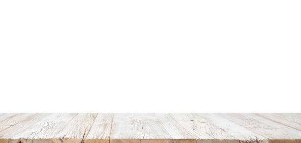 Wooden Table Isolated Empty real top of planked wooden table in perspective isolated on white background. For product display white shabby chic desk stock pictures, royalty-free photos & images