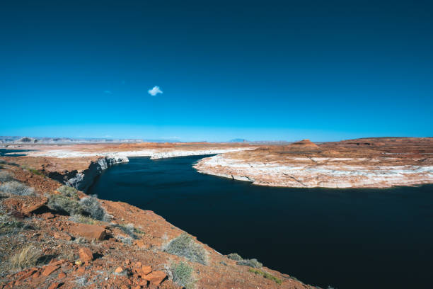 Aerial panorama view of Lake Powell near the city of Page on the border of Arizona and Utah, southwest USA. The water is a lot lower than it used to be due to climate change and high consumption of water.