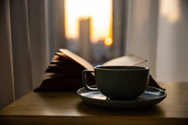 A cup of coffee and a book on the table