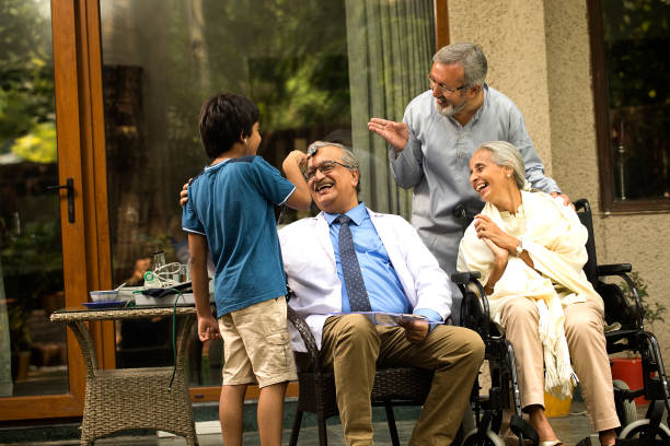 istock Doctor having fun with multi generation family at home 1432526555