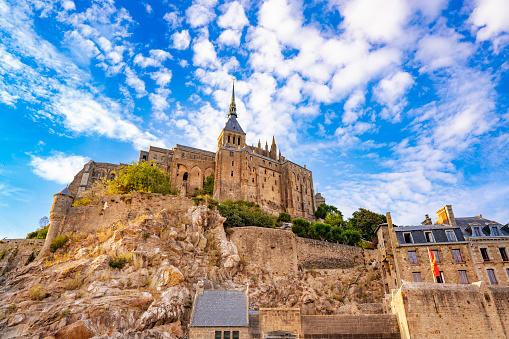 Mont Saint-Michel abbey in Normandy France, from 1979 is Unesco Heritage. All the architecture is considered historical monuments. In the year 709 the Bishop of Avranches, Saint Aubert built the first church. In 1204, Breton warriors set it on fire, the new monastery was completed in 1228 thanks to King Philip II Augustus