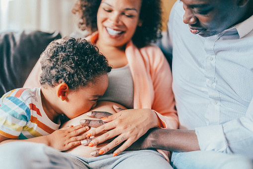 Mixed race family waiting for the new baby