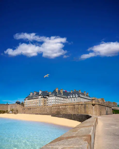 Saint-Malo Plage du Mole beach and fortress in french Brittany of Ille et Vilaine Bretagne of France, known for its walled city since the 13th century.