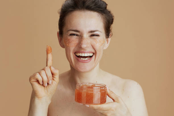 istock happy modern 40 years old woman with face scrub 1432532163