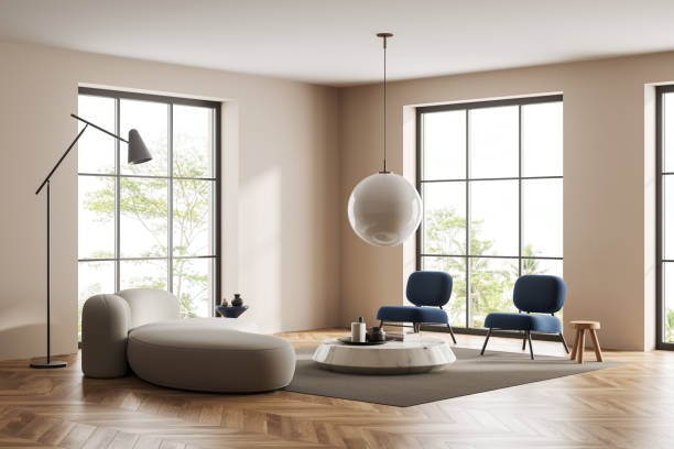 istock Light guest room interior with couch and armchairs, panoramic window 1432536828