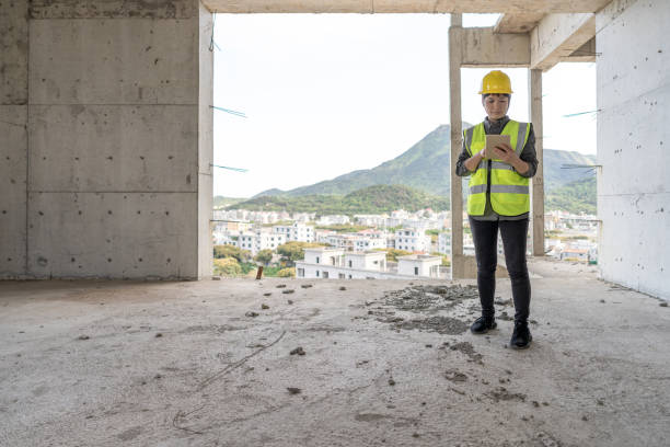 istock An Asian woman worker uses a tablet computer on a construction site 1432537160