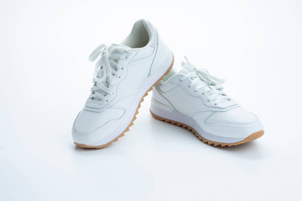 istock Pair of New Professional White Sneakers Over White Background. 1432538654