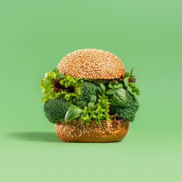 Concept vegan burger with broccoli, spinach and lettuce