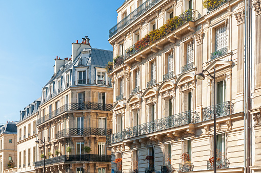 Facade  of a Parisian typical freestone building. Paris left bank. France