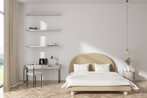 istock Light studio interior, bed and desk with laptop, shelf and window. Mockup wall 1432540586