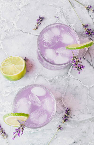 istock Lemonade with lime and lavender on gray marble background 1432542065