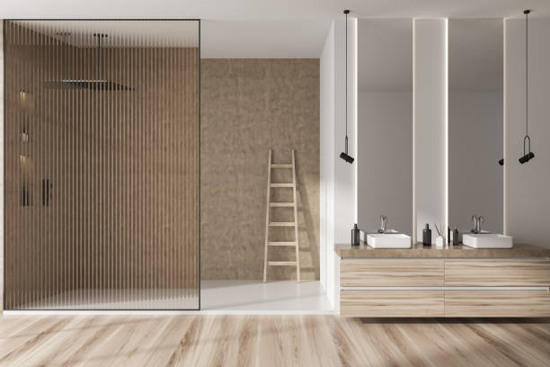 istock Light bathroom interior with double sink and douche with ladder 1432542785
