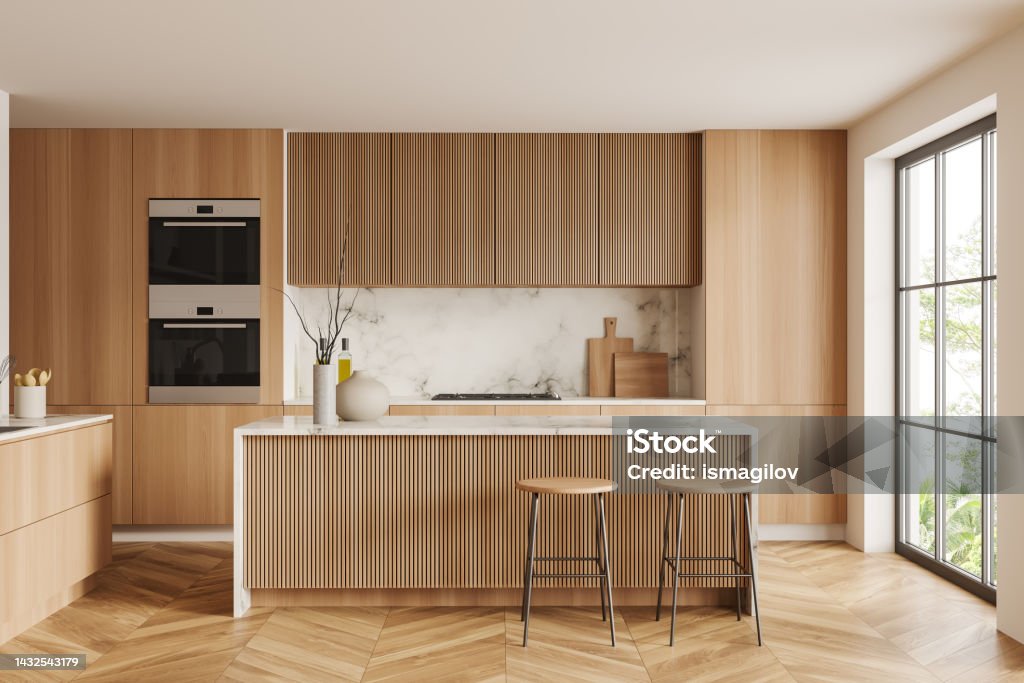Light kitchen interior with bar countertop and seats, shelves and panoramic window White kitchen interior with bar stool and countertop on hardwood floor. Kitchenware and decoration, cooking area with panoramic window on tropics. 3D rendering Kitchen Stock Photo