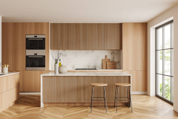 Light kitchen interior with bar countertop and seats, shelves and panoramic window White kitchen interior with bar stool and countertop on hardwood floor. Kitchenware and decoration, cooking area with panoramic window on tropics. 3D rendering stove stock pictures, royalty-free photos & images