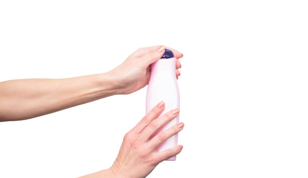 istock female hands holding shampoo bottle with copy space 1432544560