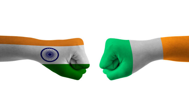 istock india vs Ireland hand flag Man hands patterned with the hand flag Man hands patterned with the india vs Ireland flag 1432546251