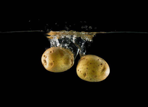 istock Falling potato tubers in water 1432546633