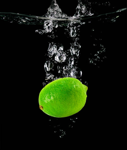 istock Citrus Lime falling into the water 1432547017