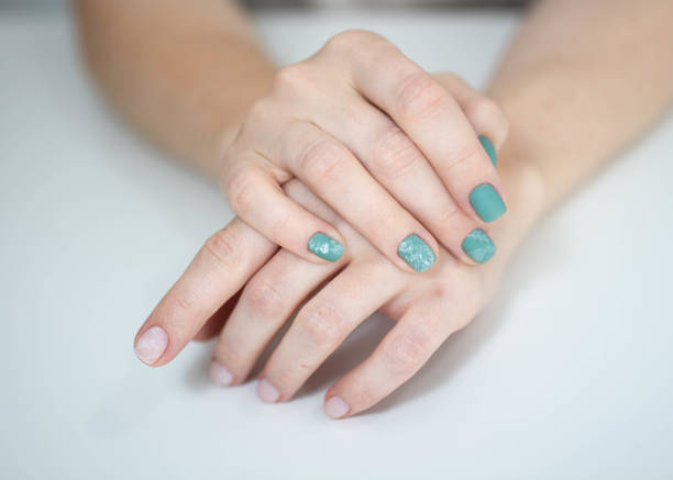 istock Beautiful female hands. Fresh manicure on the light backgroung 1432549293
