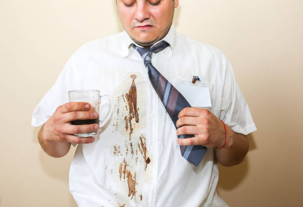 istock Office worker spills coffee on white shirt. Occupational burnout. Unhappy manager with mug in hands. Stressful job. Desperate man. 1432549342