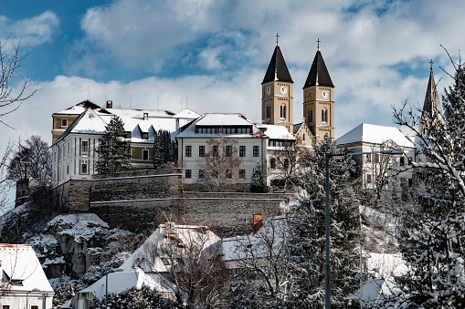 View of Veszprem with a catholic churches on a hilltop in winter