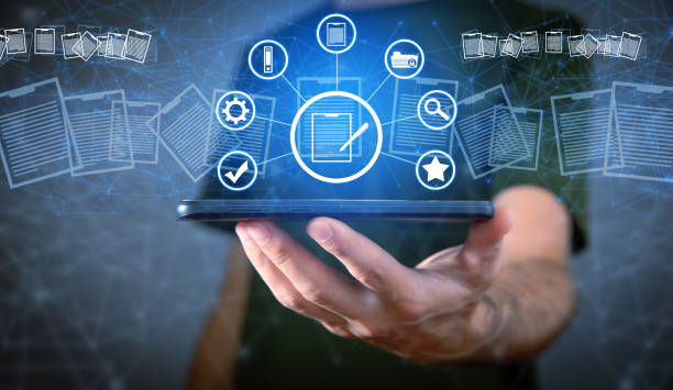 istock Businessman holding smartphone. Document Management 1432553869
