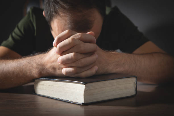 istock Caucasian man with a Holy Bible. Religion. Education 1432553906