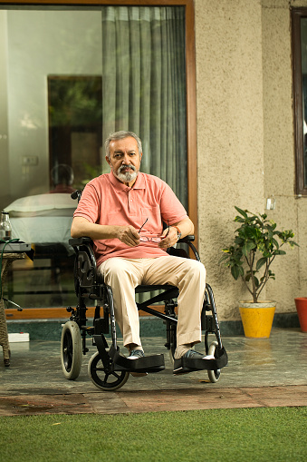 Senior disabled man sitting on wheelchair