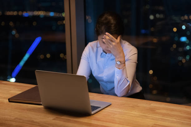 istock Fatigued young hindu female working late in office feeling burnout 1432556814
