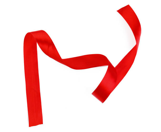 istock Shiny red satin ribbon isolated on white background 1432557366