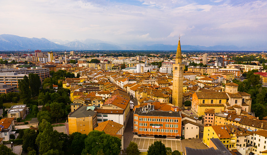 Scenic cityscape from drone of Italian town of Pordenone in sunny day, Italy