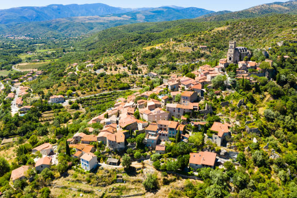istock Panoramic view from above on the city Eus. Small town located on high mountain. Eastern Pyrenees 1432559601