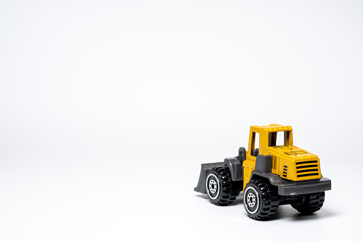 A model of a bulldozer on a white background.